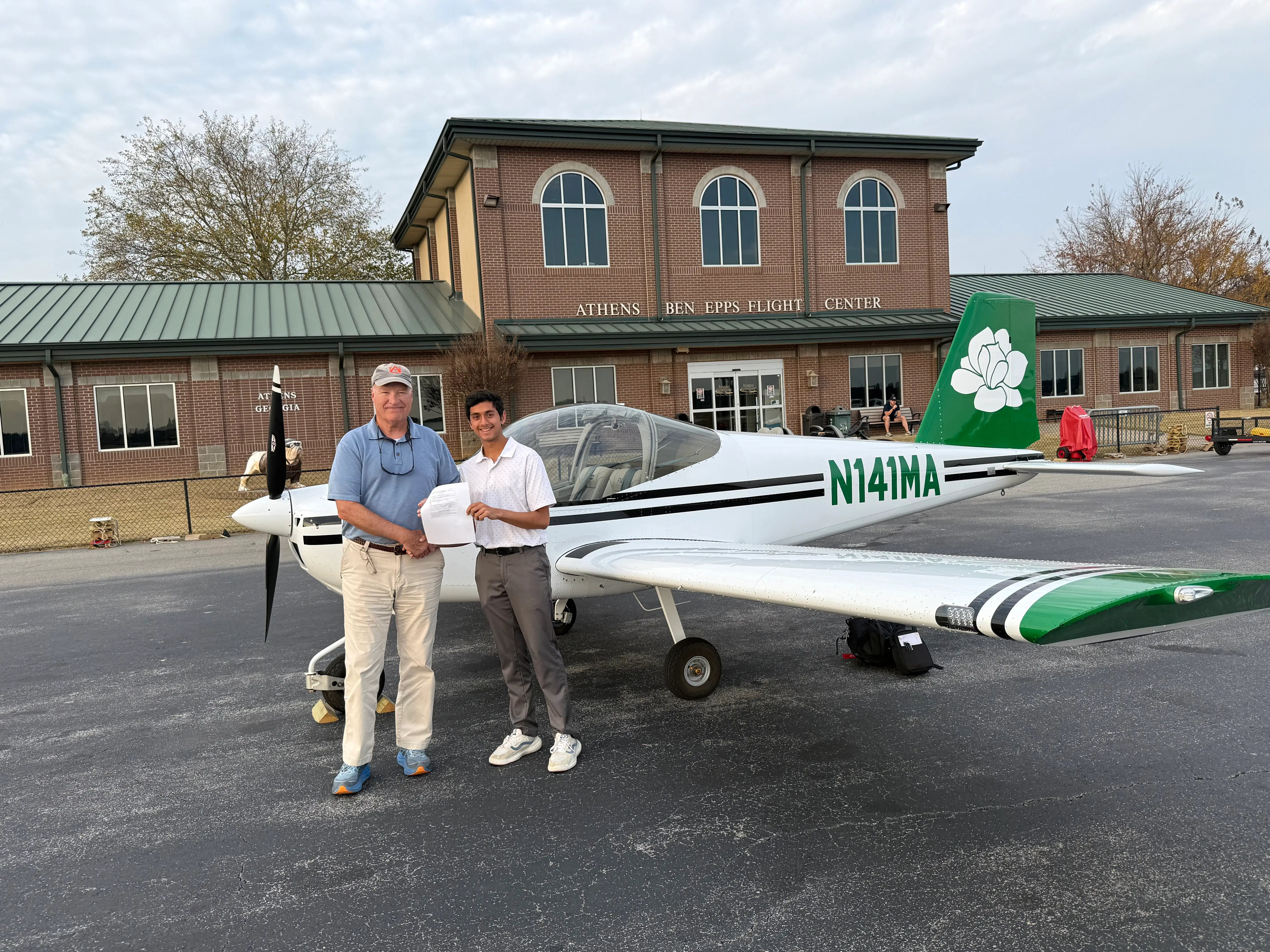 Magnolia Aviation Academy student with cfi in front of aircraft