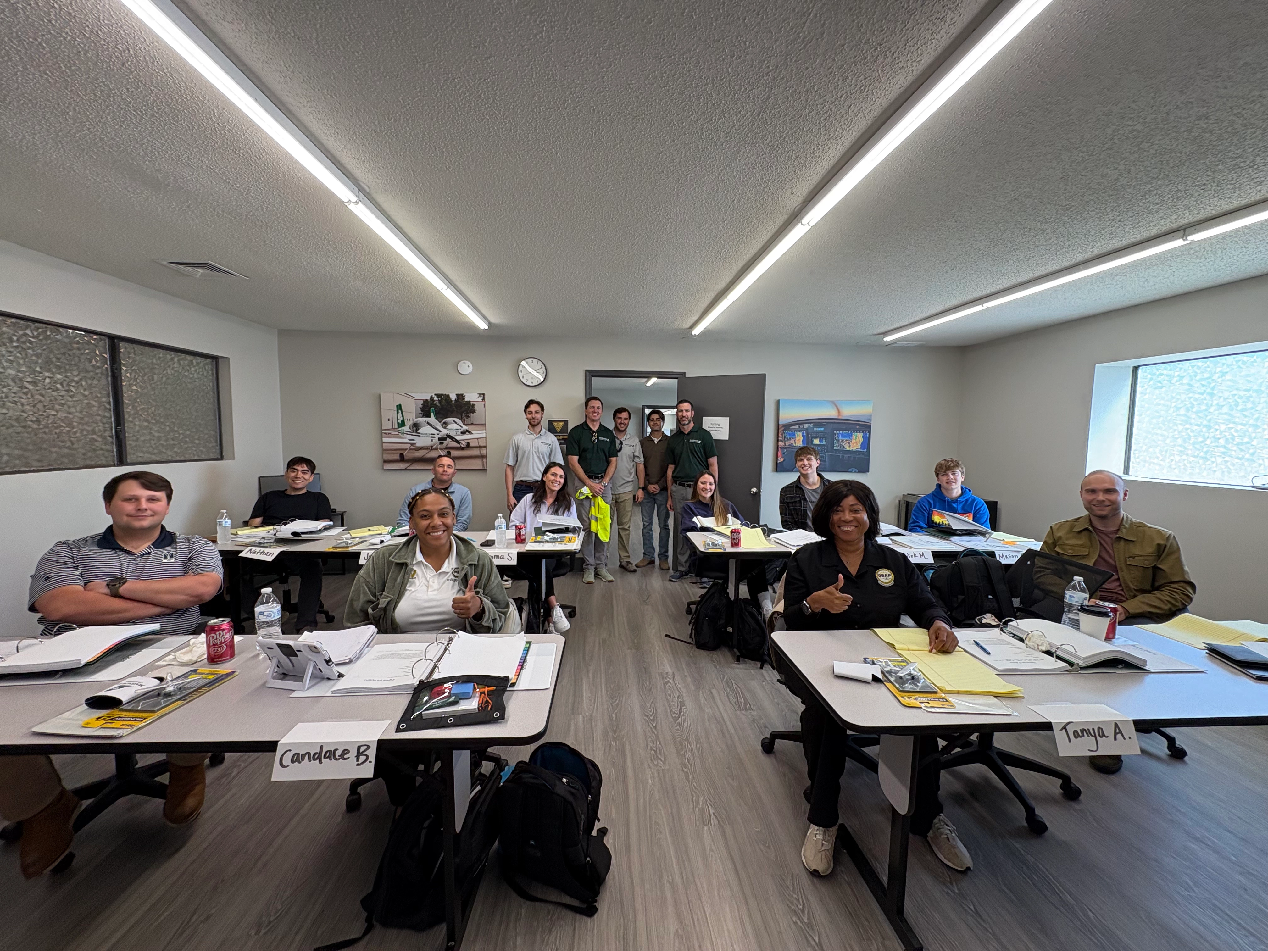Magnolia Aviation Academy student pilots and instructors preparing for flight lessons at Charles W. Baker Airport