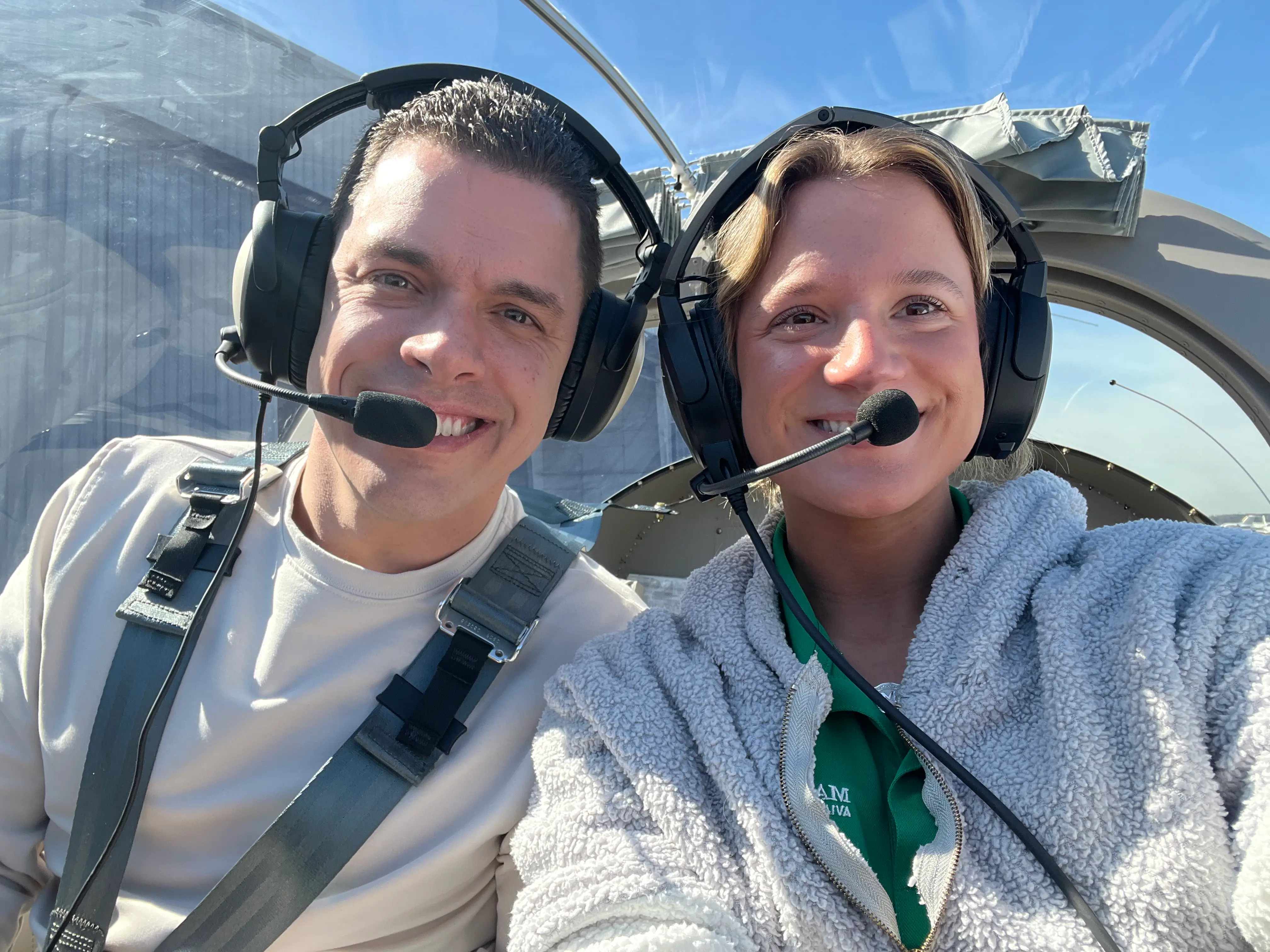 Magnolia Aviation Academy student with CFI selfie inside cockpit while flying