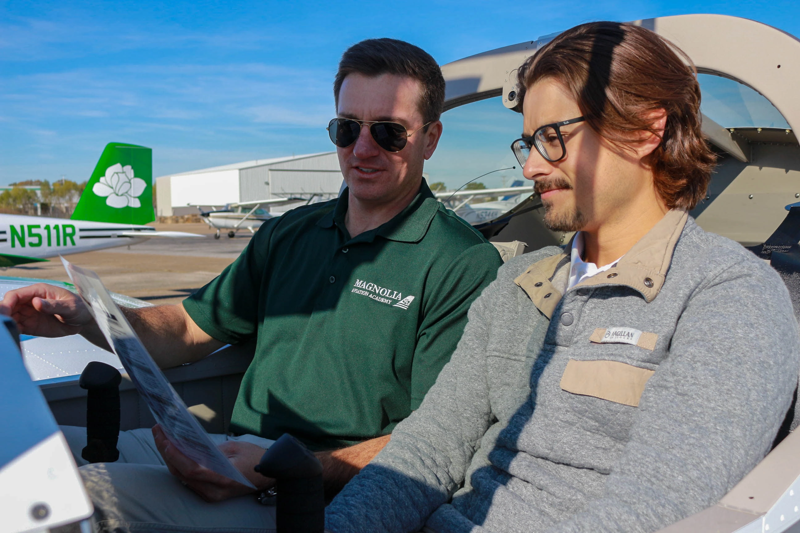 Magnolia Aviation Academy training aircraft and student on the flight line